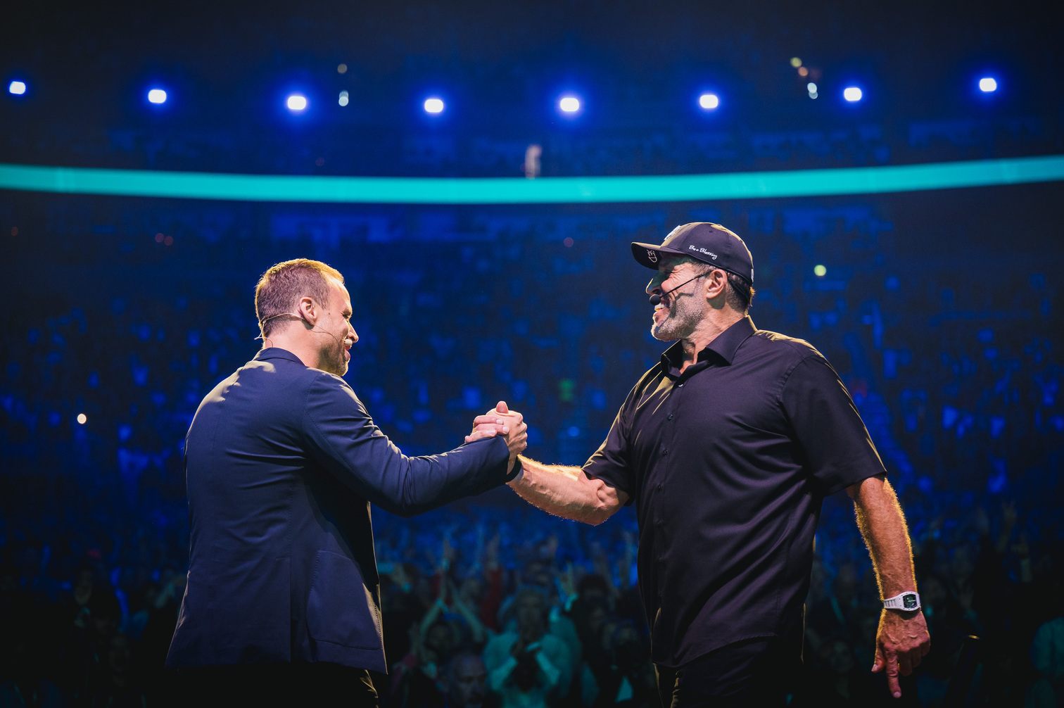 Speakers connecting on stage at a Fortuna One event